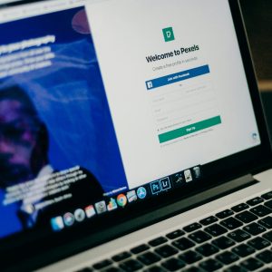 Close-up view of a laptop displaying a sign-up page for an online platform.